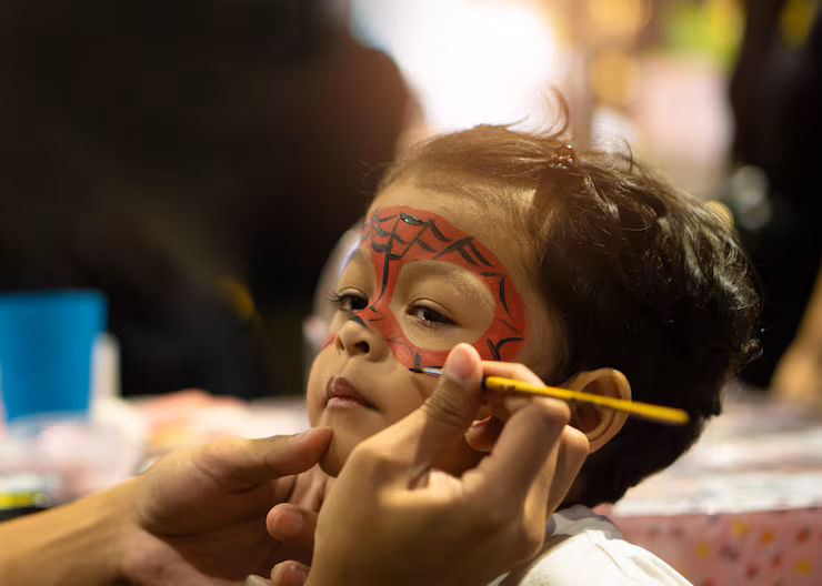 asian-kid-boy-with-painted-face-as-spider_38013-173
