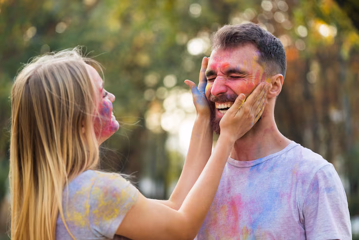 couple-playing-with-powdered-paint_23-2148338036