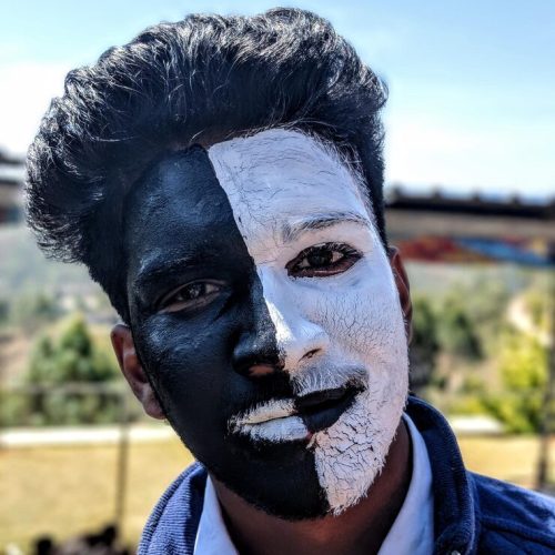 close-up-portrait-man-with-black-white-face-paint_1048944-25889911