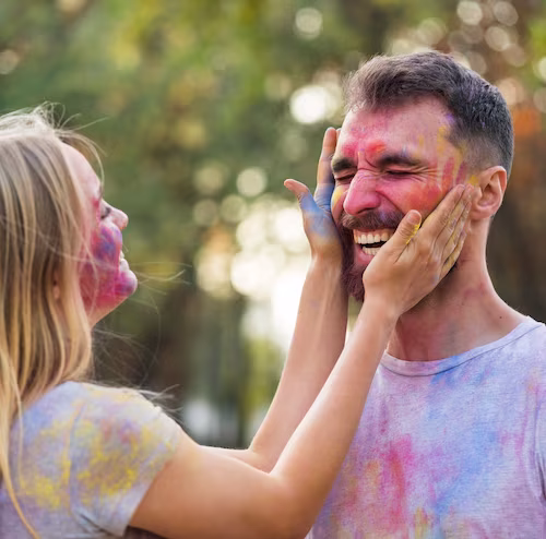 couple-playing-with-powdered-paint_23-2148338036